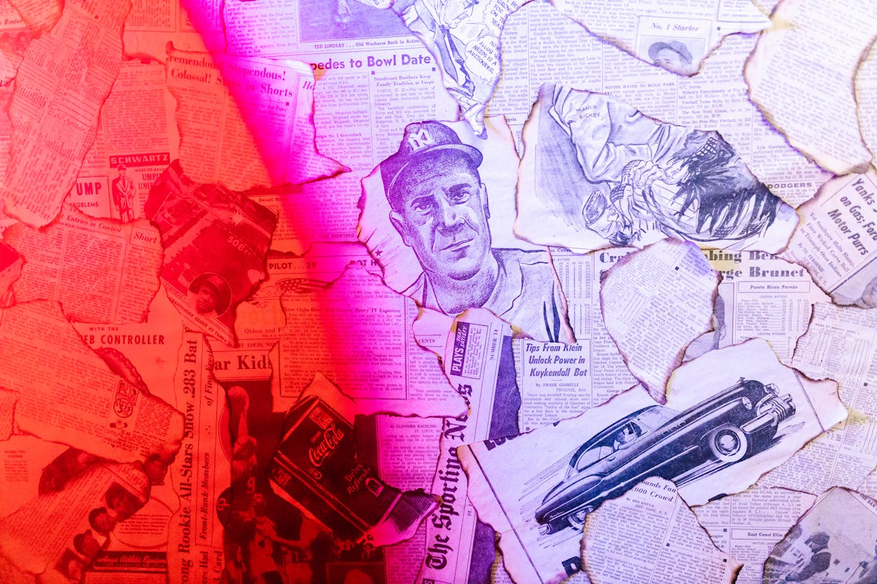 who-we-are Creative collage of vintage newspapers and illustrations with a striking red lighting effect.